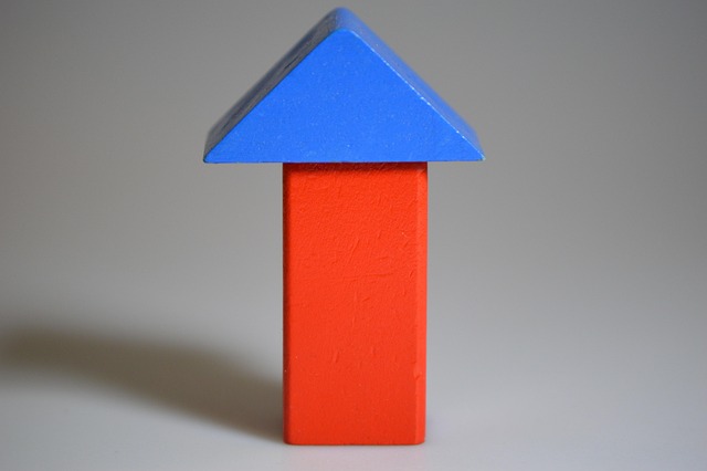Colourful wooden building blocks arranged on a surface